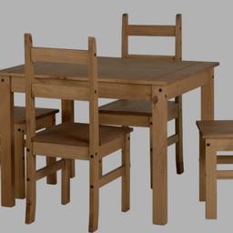 A very good and strong Oakwood dinning table for four persons with chairs .