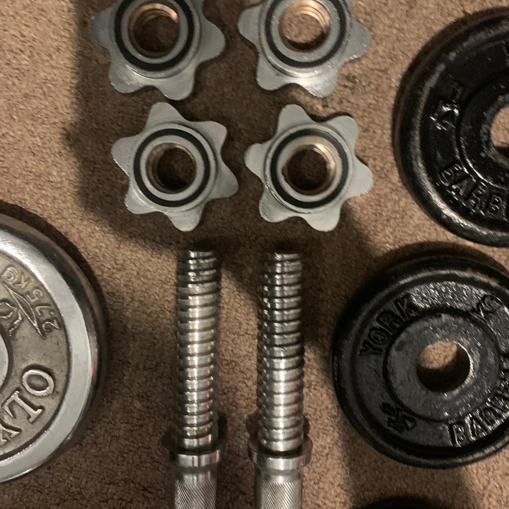 used but still in ok condition silver plate is 2.75kg small black plate is 0.5kg and big black plate is 1.25kg. perfect to start slow with home gym