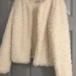 Cream faux fur jacket very soft. Edge to edge style. Excellent condition only worn once for winter wedding. Size 12. Collection only from non smoking no pets household. Any questions welcome.