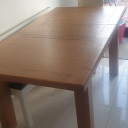 This dining table since bought has had a cover on it therefore the wood is still in excellent order without any scratches. Want to sell this as wish to buy something else.  Originally bought it for £500. Looking for £200. Measurements length 65" x 35". When extended length is 91" Collection only