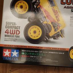 Bought this last year started it but have a few things on the go never finished it so needs to go to someone to finish building it and enjoy it. Comes with instructions.
 Lunch Box is a famous name in Tamiya R/C and Mini 4WD, delighting many a hobbyist over the years. Now, it is here in brand new mini 1/24 form, as a fascinating R/C model assembly kit! While extremely compact, it is endowed with excellent mechanical design: gear driven 4WD, strut suspension and more! The lightweight polycarbonate body comes pre-painted in yellow, with wheel arches pre-cut and body mount holes already made. Stickers are included to decorate the body.
