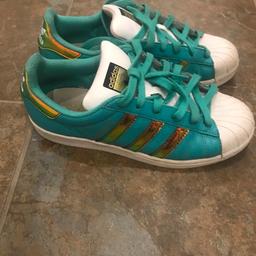 Adidas Superstars
Bespoke one of a kind
Aqua/turquoise with white shelltoes and soles and iridescent gold stripes and backs
UK 6.5

Used but loads of life left in them

Collection from Whitefield Manchester M45 or buyer to pay postage