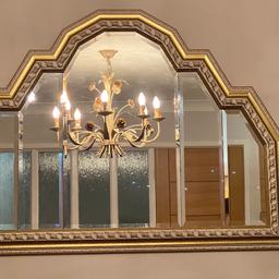 Stunning bevelled framed mirror , ready to hang in excellent condition. Over mantle mirror cathedral style . 5 separate pieces of bevelled edge mirror framed in an antique style frame . Changing decor and style only reason I’m selling . Comes from a smoke and pet free home . Pick up only