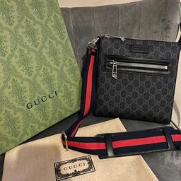 This is a high end gucci messenger bag that is created with a large spacing inside for people wanting to carry a few extra things with them while out on a journey but want to walk in style.