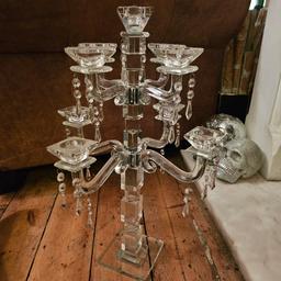 this is a stunning 8 arm candelabra its 60 cm tall and can hold 9 tealights or dinner candles

it has one teardrop missing but its impossible to notice

can collect or am happy to meet you at any tube station in zone 1 or 2 but cannot post due to the fragility