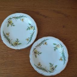 Royal Grafton bone china dishes (2). The pattern is white China with small yellow flower and a few green leaves. Immaculate condition. Not been on display but wrapped and put in a box. Vintage item.
