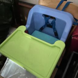 Portable baby feeding chair that can be folded and the tray removed, it works by strapping to any sturdy dinning chair.