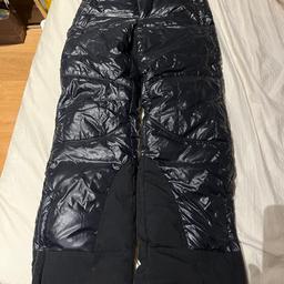 Moncler snow pants filled with real down feathers, has 2 zipped side pockets and 1 zipped back pocket, bottom side zips with inner buttoned layer, suitable for 152cm / 12 year olds.