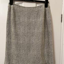 Soft feel fabric with a bit stretch to it.zip fastening at the back.pencil skirt style with small split at the back.fully lined.length of skirt 55cm.from Wallis in good condition