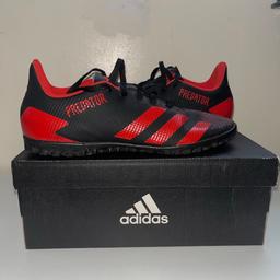 Fairly new turf boots black and red predator boots size 8 men’s