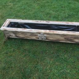 Handmade wooden planter approximately 5 foot x 10.5 inch x 11 inch lined and treated can be painted in most popular colours with flower or heart motif or personalised e.g Charlie’s garden . These are bespoke and made to order price starts at £20 and delivery is at 50p a mile