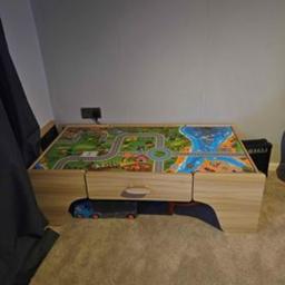 Toddler play table with drawer, no marks on table, will fit in the back of a car, good for play and storage.