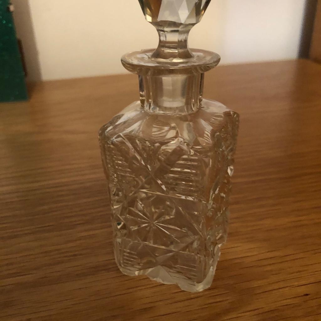 Square glass perfume bottle lovely pattern 12 cm with stopper good condition. Thanks