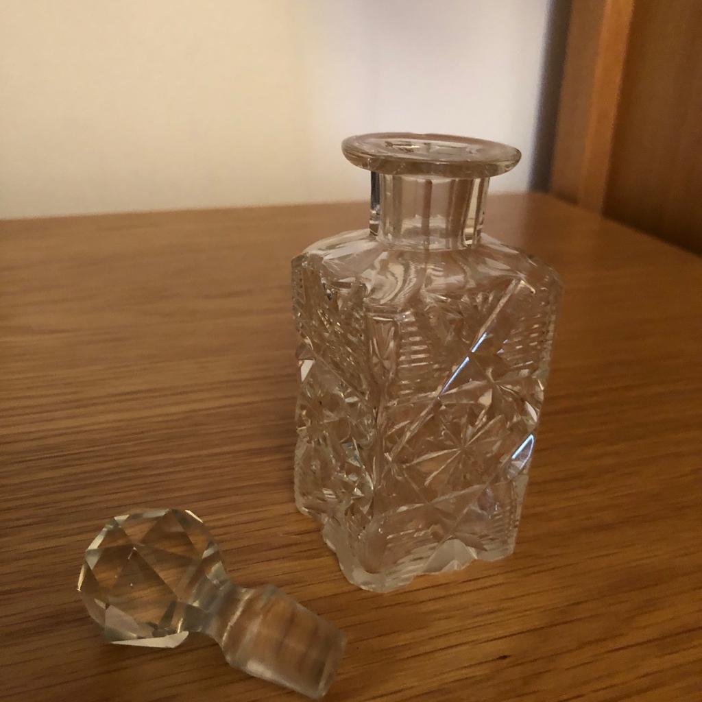 Square glass perfume bottle lovely pattern 12 cm with stopper good condition. Thanks