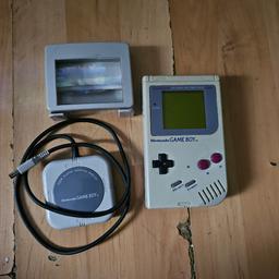 The Original 1989 First Edition Nintendo Game Boy. Comes with light magnifier that works but rust if you have not used it in awhile have to repeatetly switch onn and off until it works then works fine. A Nintendo Multiplayer Adaptor and 12 games. 5 compatible with the Multiplayer Adaptor that is Bust A Move 2,F1 Race,World Cup 98,Tetris and Fifa 2000. Other 7 Wwlf Super Stars ,T2 Judgement Day,True Lies,Robin Hood Prince Of Thieves,Kirbys Pinball,,Double Dragon and Jelly Boy..Collection