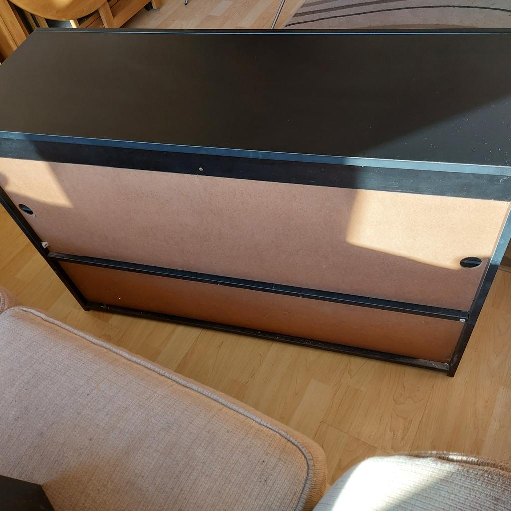Black TV/Gaming Unit with Cupboard. Great Condition
4 shelves ideal for Gaming and TV
Also has lower cupboard as per pic

L = 100 cm
D = 35cm
H = 65cm

Can deliver locally as built for £5 within 5 mile radius