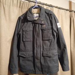 Superdry Rooky Military style jacket, Black, heavy cotton, size Large, fur lined for winter, union jack on left arm,many pockets, hardly worn hence excellent condition, No Delivery Collection Only