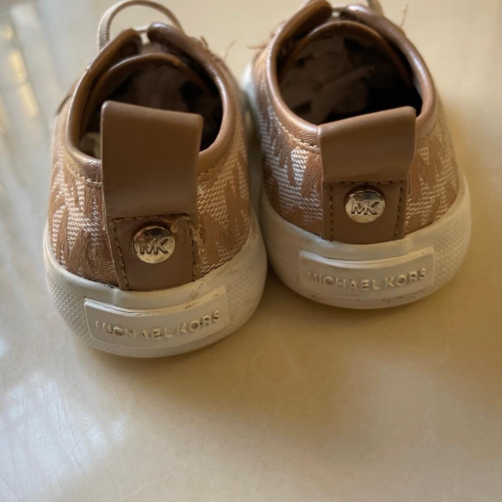 Girls size 6.5 MK trainers, one of the flap on the back of trainer has come apart see picture , easy fix with some glue. Apart from that in good condition.