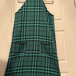 Beautiful green & black dress from River Island. Age 9-10 years. But id say a larger size size 9-10 years, it took my daughter ages to grow into it & she is normally a size bigger than her age. 2X buttons that fasten at the back of the neck (can be seen on 2nd photo). Front of dress has 2X pockets with black & gold detail button. Never been worn. Cost £40 brand new. Doesn’t have tags.