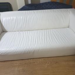 white sofa. It can seat up to three people. Still has loads of life left. In fair condition but looks good. only selling as I have no where to put it.