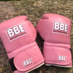 Pink boxing fitness gloves . BBE Britannia 12 oz gloves . Used but good condition still plenty of wear left in these . Great pink set .
