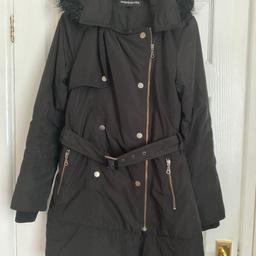 Ladies size 12 mid thigh length outdoor hooded jacket/coat from Warehouse. Good condition. Woven cuff inside the sleeves. Off centre zip. Zipped pockets. Mock press studs. Lovely coat. Just too small for me. Welcome to try on before you buy.