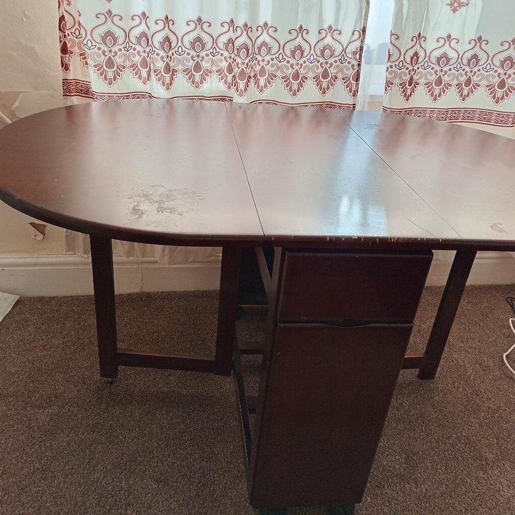 brown in colour wooden table in very good condition