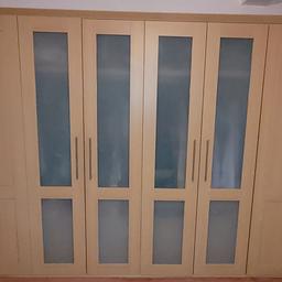 Run of 4 double wardrobes. Overall size 2160 H X 600 D X 3552. Complete with doors, handles and hinges. 4 Doors are shaker style in oak and the other 4 are matching but with frosted glass. All have clothes rails and two come with 4 drawer internal chests, one has 6 half width shelves and the other has a 2 shelf, half width unit. Each of the wardrobes is also listed seperately in my items for sale. Collection Only.
