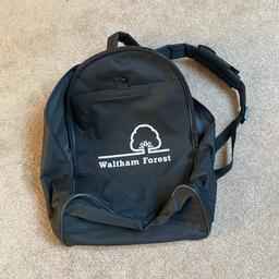 New Black backpack with straps, internal zipped pocket and large external pocket with Velcro fastening. Has white London borough of Waltham Forest logo. Could be used for school, sports, shopping, travel etc. Never used. Can post for extra.