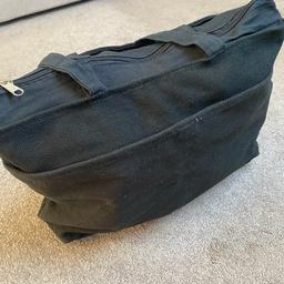 Black jute/cloth bag with zip, handles and large front pocket. Measurements: 42cm/34” x 34cm/13.5”. Lightweight and useful for travel, shopping etc. Had 3 of these and this one been in storage and never got round to using. 