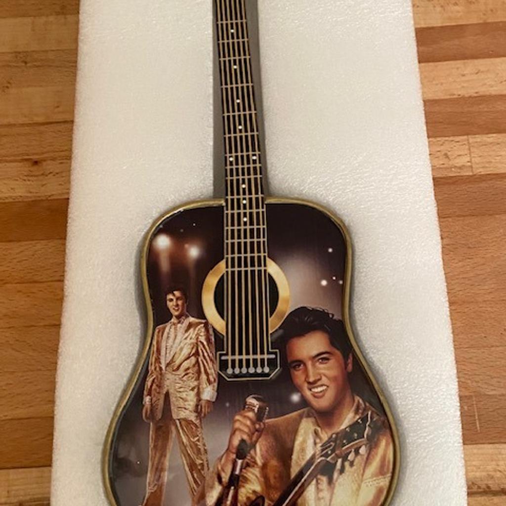 VERY VERY RARE TO FIND THIS IN THE UK BRAND NEW / MINT Condition
This was released by Bradford Exchange and is STRICTLY NUMBERED.
As you can see in the pics the back of the guitar changes colour and would look amazing hung up (there is a clasp on the back for it to be hung).
Just over 11cm in height.
I have sold over 3000 Elvis items (!) with a positive feedback score of 100% so you are in safe hands!
And as my regular customers know I only post the highest quality items. So yes may cost more but you have guarantee of quality from a specialist Elvis seller. Please feel free to visit my page and read reviews.
I also have the largest number of Elvis items for sale. The spectrum includes…..DVDs, CDs, VHS, tapes, records, magazines, books, rare concert CDs….and MANY MORE RARE ITEMS…..AND MORE!!
Be quick and good luck!
 REF: 11