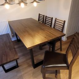 Set of modern rustique styled dining table (L: 180 cm, W: 90 cm, H: 78 cm) with four matching leather covered chairs as well as a matching bench for two (L: 132 cm, W: 40 cm) in very good condition. Made from solid hardwood with a dark finish and with metal sleigh legs.
Bought from Oak Furniture Land for 1200 £ new a year ago. Asking price 250 £ , for collection only near Nantwich.