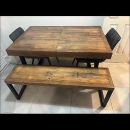 Rustic/industrial style extendable dining table with matching bench. Bought from next. Solid piece of furniture very heavy. Chairs also included for free as they have some small tears in from the doors being opened on them. 
From a pet free smoke free home. 
140cmx90com
Extended length is 165cm