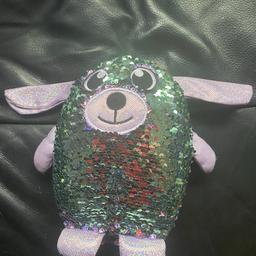 Used but in near perfect condition as hardly used. Sequinned soft toy dog that is reversible purple and green. Smoke & pet free home. Collection only.
