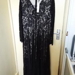 Absolutely stunning lace dress by Gemma Collins. It looks absolutely fantastic on. It has a shorter lining underneath to show your legs through the lovely lace. I paid £80.00