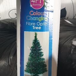 Green Fibre Optic Christmas Tree lovely when decorated and lit up 4ft in height excellent condition and a box of Xmas decorations and oriments with lights no longer needed due to a bereavement buyer collects £10.00 used once