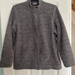 Grey and black fleck ladies fleece jacket, with front zip and pockets, size 18 by M&S.
Worn a few times but has ben washed and is still in good condition.
