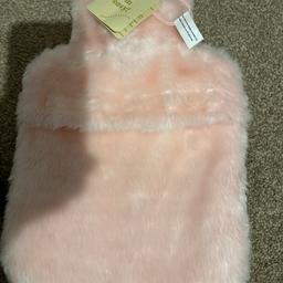 Brand new warm and cosy hot water bottle with faux fur cover from Boots.