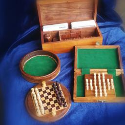 A collection of 3 wooden boxes with games in Chess, Dice, Cards etc. Ideal for displaying or playing or used as trinket boxes. Collection only.