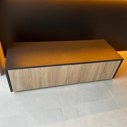 Two matching TV Units anthracite with wood effect doors each are 1240mm x 450mm
and 345mm high.

Each comes with a single shelf in the middle of each door.

Used to house 70” in TV when placed side by side

Priced as the pair.