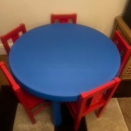 Hard plastic table. Five red wooden chairs. Minimal wear and tear. In good condition. Would like to sell the complete set. Chairs alone cost £15 each. From a halal and pet free home. Only used for about six months. Silly offers will be ignored. PICK UP ONLY PLZ.