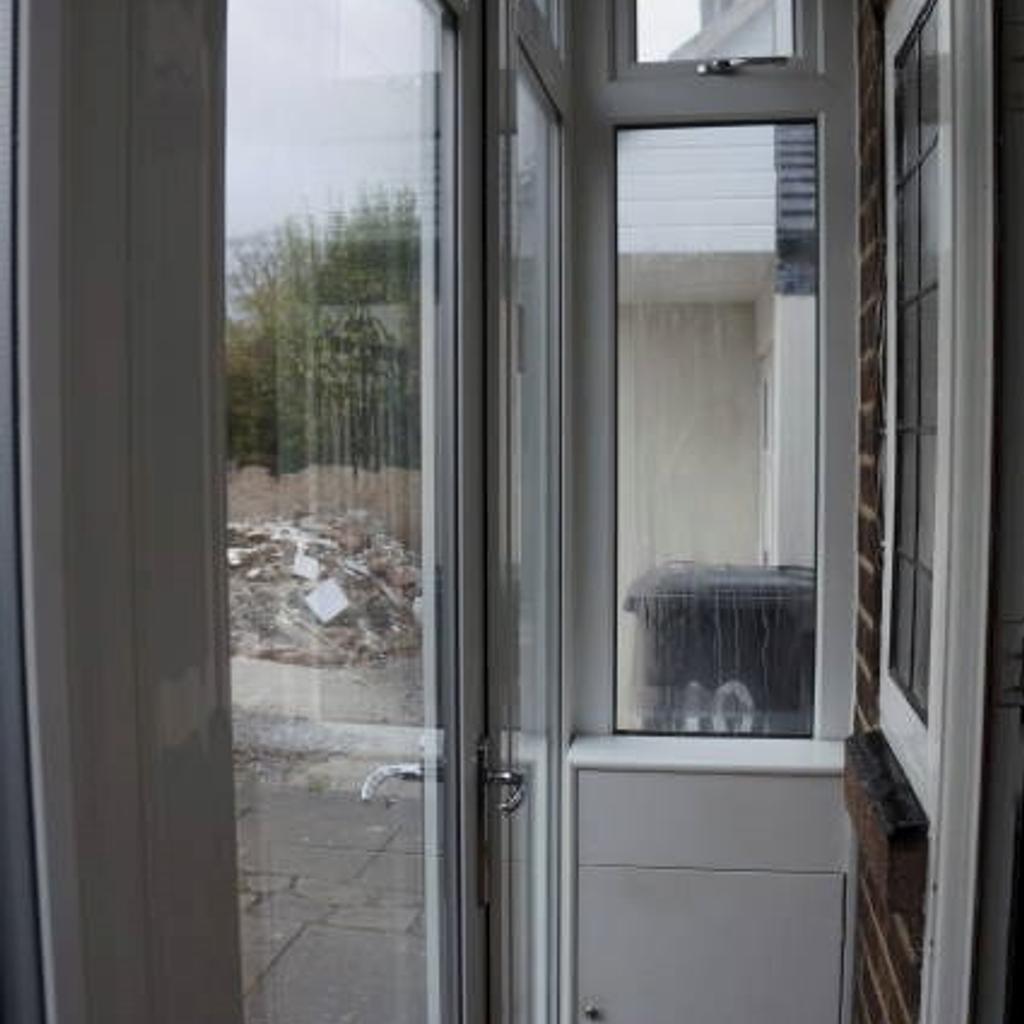 REDUCED - Lean on Front UPVC Double-Glazed Porch with free post box - door hinge is damaged and needs replacing (price reflected to suit). Helps preserve your energy bills and increase security at the same time.

Top to bottom toughened glass where some of the glass seal has failed and condensates (as shown) and door is cracked on the hinge - price reflected to suit.

Measures:
Front Section with single door 3650mm
Side return with white panel bottom in bottom end with letter plate 710mm wide
Overall Height 2175mm
UPVC Cladded Ceiling

Features:
Window opener on the side return (no key)
Leans onto the front bay window
Bespoke built wooden cupboard to conceal post

Buyer to dismantle and take away.
