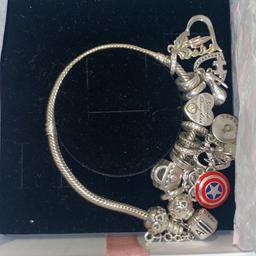 Pandora bracelet worn a couple of times comes with a box and many charms