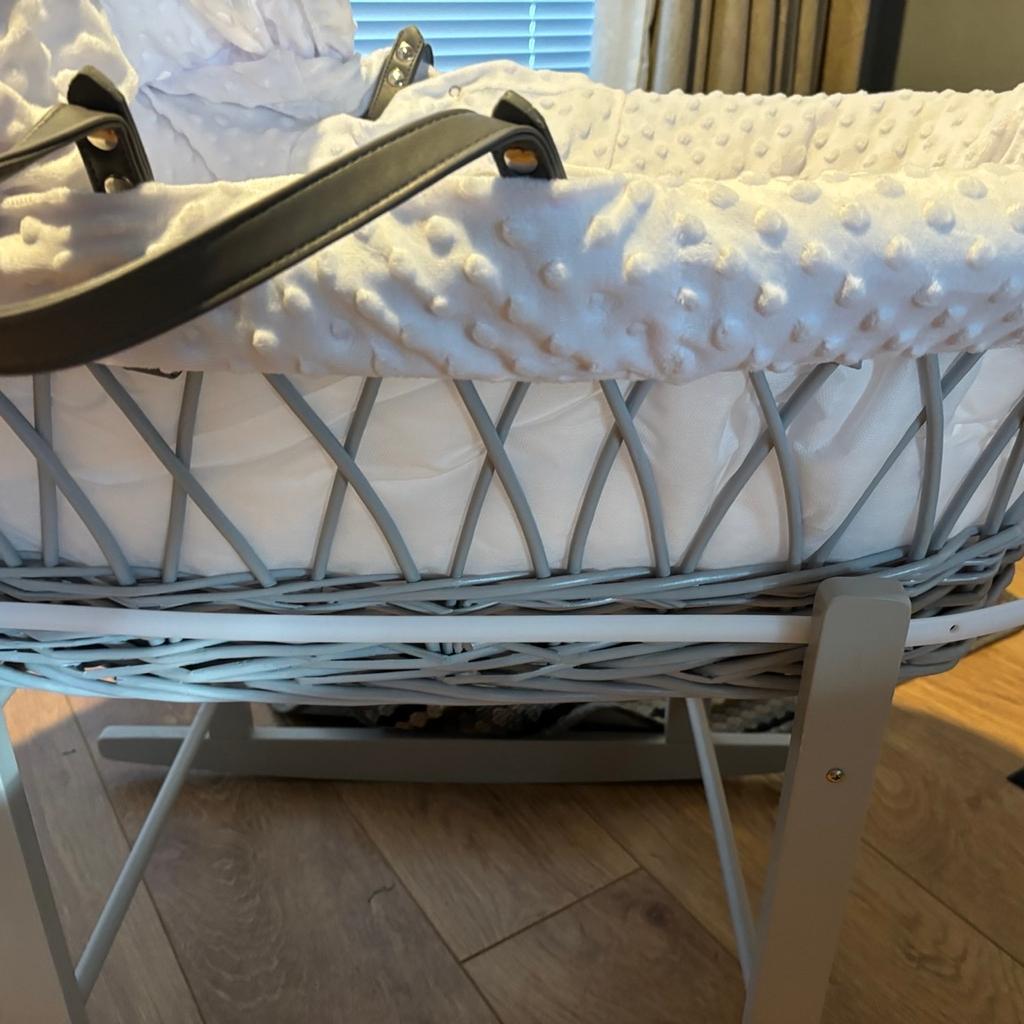 Moses Basket with stand. Only been used a couple of times. Stand can also be used for baby bath.