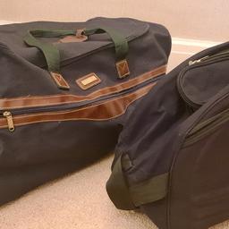 Black travel bag with wheels. Also dark green travel bag with wheels .Good condition. Both bags for £5