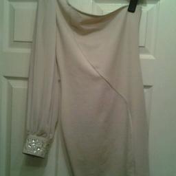 Nude off the shoulder bodycon style dress, one sleeve chiffon with jewel encrusted cuff. worn only once & in excellent condition. Lovely for a party or wedding. Bargain price. have a look at my other items for sale. Thanks
