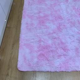 Beautiful baby pink shaggy pile washable rug
rug unfortunately loo lady for the room.