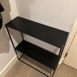 Black metal two tier console table. Great for hallway entrances or small spaces

Height - 70cm
Width - 60cm
Depth - 20cm
