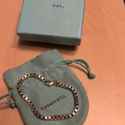 Vintage Tiffany & Co. Venetian link bracelet, full London hallmarks for early 2000s.  Comes with pouch and box.  Measurement in photos.  Have not cleaned recently.  PLEASE PAY ATTENTION TO PHOTOS as they are part of description. Used items so may have signs of wear or defects. Please see all photos as is part of description, post and combine items. No returns.