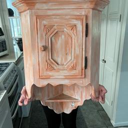 Corner wall cupboard painted pine , measures 30” top to bottom sides are 11” and it’s 18” across pinky white in colour